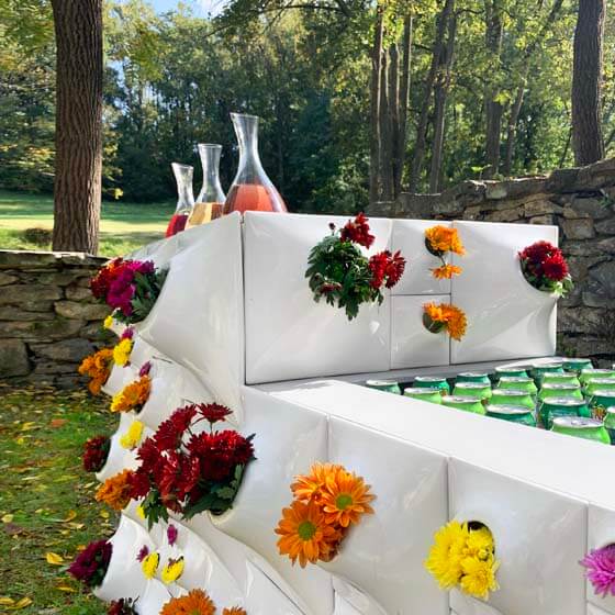 white ceramic wall planters with flowers for event bar