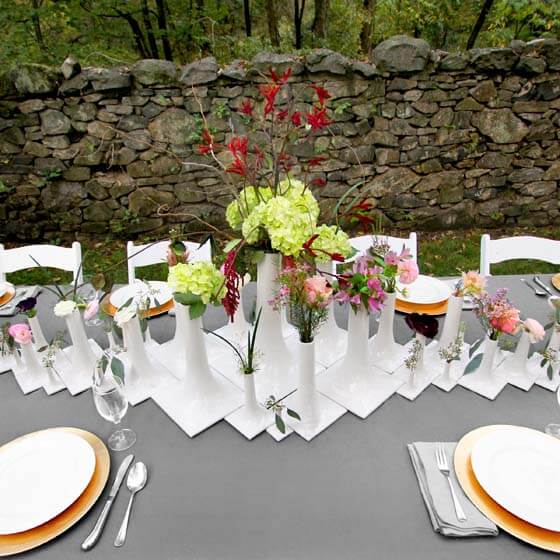 modern wedding tablescape with white ceramic vases